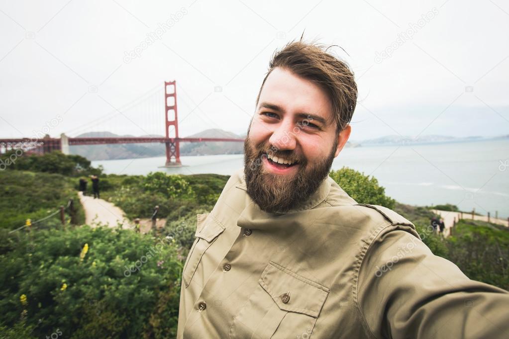 Handsome bearded man making selfie