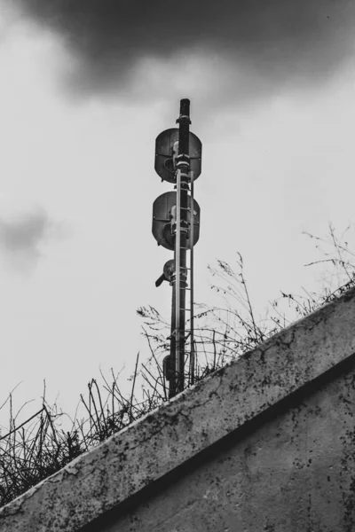 Railway traffic light in black & white.