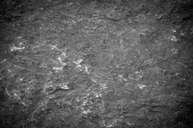 Siyah taş levhaların soyut arkaplan deseni. Büyük granit kayaların deseni