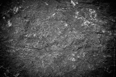 Siyah taş levhaların soyut arkaplan deseni. Büyük granit kayaların deseni