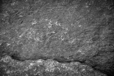 Siyah taş levhaların soyut arkaplan deseni. Büyük granit kayaların deseni