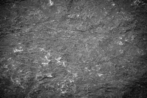 Siyah taş levhaların soyut arkaplan deseni. Büyük granit kayaların deseni