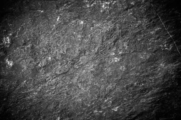 Siyah taş levhaların soyut arkaplan deseni. Büyük granit kayaların deseni