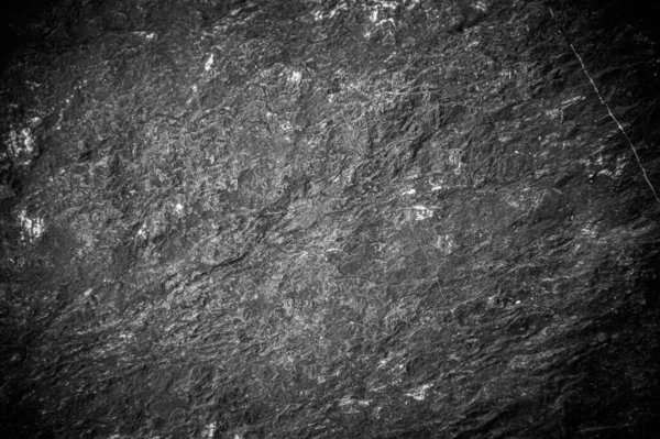 Siyah taş levhaların soyut arkaplan deseni. Büyük granit kayaların deseni