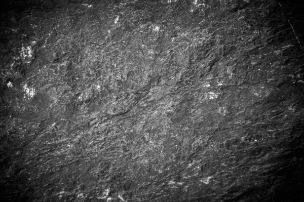 Siyah taş levhaların soyut arkaplan deseni. Büyük granit kayaların deseni