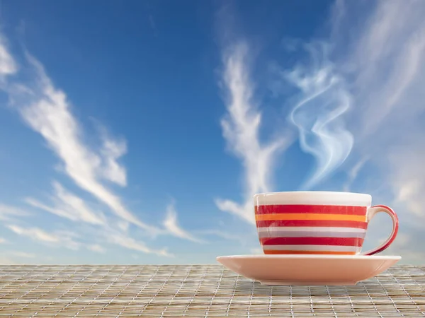 cup of coffee on the background of the sky
