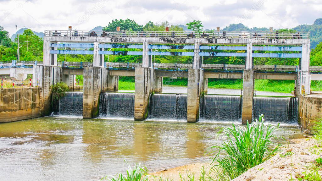 Medium-sized dam in rural Thailand. Small dams block canals in rural areas. dam in irrigation system