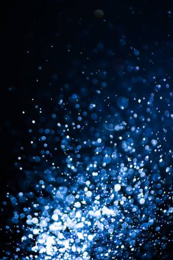 Bulanık lensten mavi bokeh 'in soyut arkaplan resmi. arkaplan kullanımı