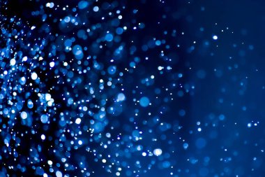 Bulanık lensten mavi bokeh 'in soyut arkaplan resmi. arkaplan kullanımı