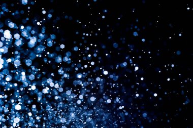 Bulanık lensten mavi bokeh 'in soyut arkaplan resmi. arkaplan kullanımı