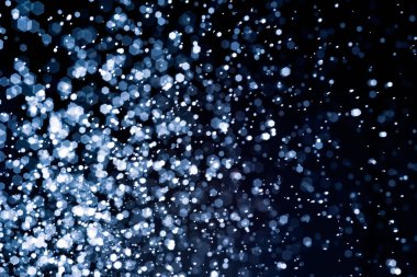 Bulanık lensten mavi bokeh 'in soyut arkaplan resmi. arkaplan kullanımı