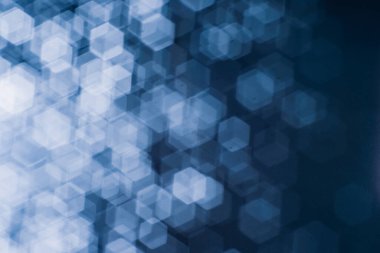 Bulanık lensten mavi bokeh 'in soyut arkaplan resmi. arkaplan kullanımı