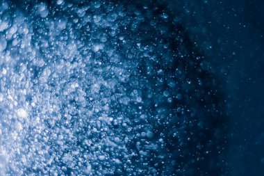 Bulanık lensten mavi bokeh 'in soyut arkaplan resmi. arkaplan kullanımı