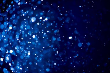 Bulanık lensten mavi bokeh 'in soyut arkaplan resmi. arkaplan kullanımı