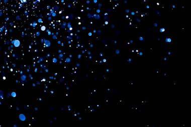 Bulanık lensten mavi bokeh 'in soyut arkaplan resmi. arkaplan kullanımı