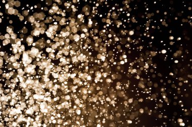 Güzel Noel ışıklarının bulanık görüntüsü, bokeh etkisi. Güzel Altın Renk Bokeh Etkisi. Işıltılı ışıklar arka plan grunge, parıltı soyut Parıltılı Işıklar ve Yıldızlar Noel Arkaplanı.