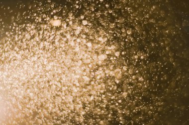 Güzel Noel ışıklarının bulanık görüntüsü, bokeh etkisi. Güzel Altın Renk Bokeh Etkisi. Işıltılı ışıklar arka plan grunge, parıltı soyut Parıltılı Işıklar ve Yıldızlar Noel Arkaplanı.