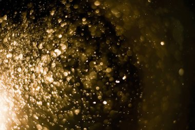 Güzel Noel ışıklarının bulanık görüntüsü, bokeh etkisi. Güzel Altın Renk Bokeh Etkisi. Işıltılı ışıklar arka plan grunge, parıltı soyut Parıltılı Işıklar ve Yıldızlar Noel Arkaplanı.