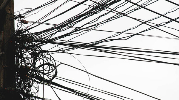 Messy electrical and communication cables. The concept of insecurity and carelessness