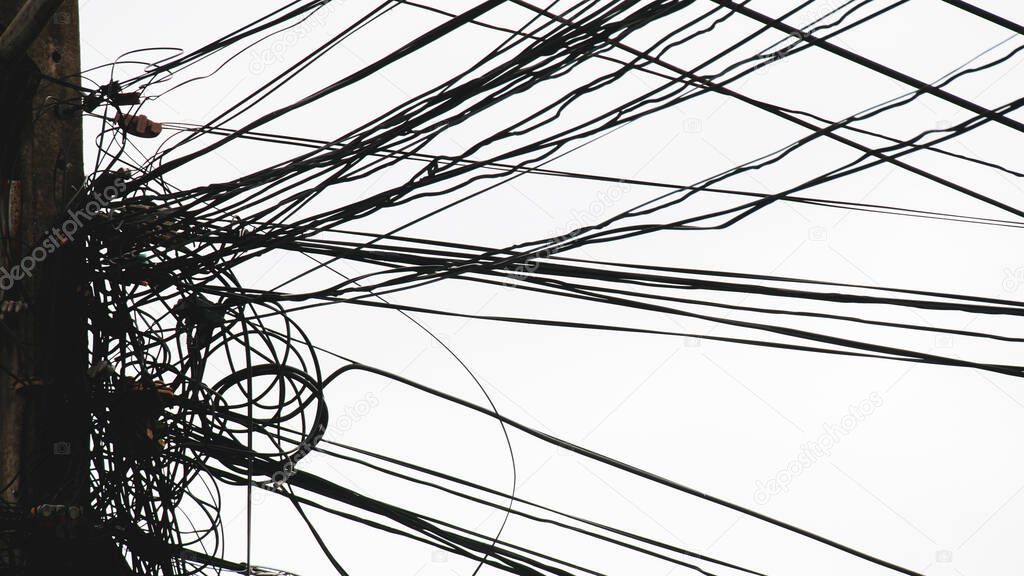 Messy electrical and communication cables. The concept of insecurity and carelessness