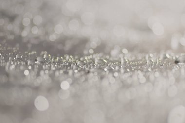 Su damlacıkları ve bulanık lensler tarafından oluşturulan Bokeh 'in soyut arkaplanı.