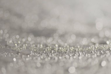 Su damlacıkları ve bulanık lensler tarafından oluşturulan Bokeh 'in soyut arkaplanı.