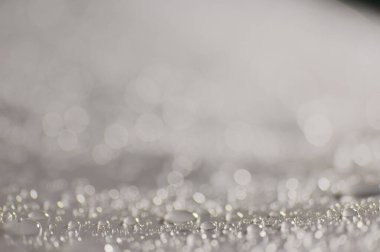 Su damlacıkları ve bulanık lensler tarafından oluşturulan Bokeh 'in soyut arkaplanı.