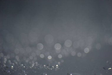 Su damlacıkları ve bulanık lensler tarafından oluşturulan Bokeh 'in soyut arkaplanı.