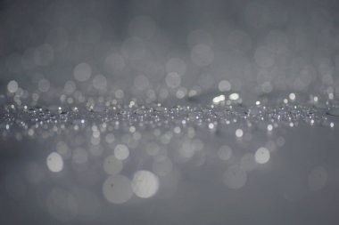 Su damlacıkları ve bulanık lensler tarafından oluşturulan Bokeh 'in soyut arkaplanı.