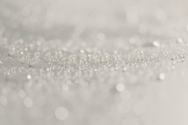 Su damlacıkları ve bulanık lensler tarafından oluşturulan Bokeh 'in soyut arkaplanı.