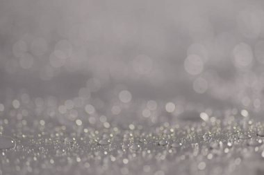 Su damlacıkları ve bulanık lensler tarafından oluşturulan Bokeh 'in soyut arkaplanı.
