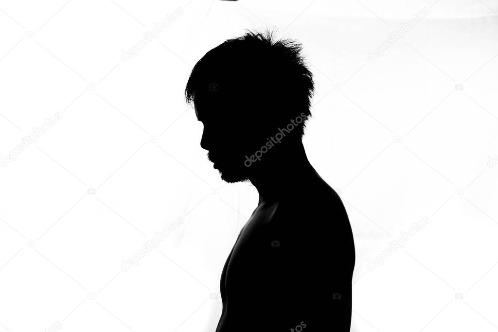 Side image half shadow of a man. silhouette of a man on a white background