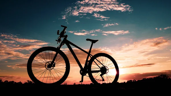 Silhouette of a mountain bike with beautiful lighting. Relaxation and exercise concept