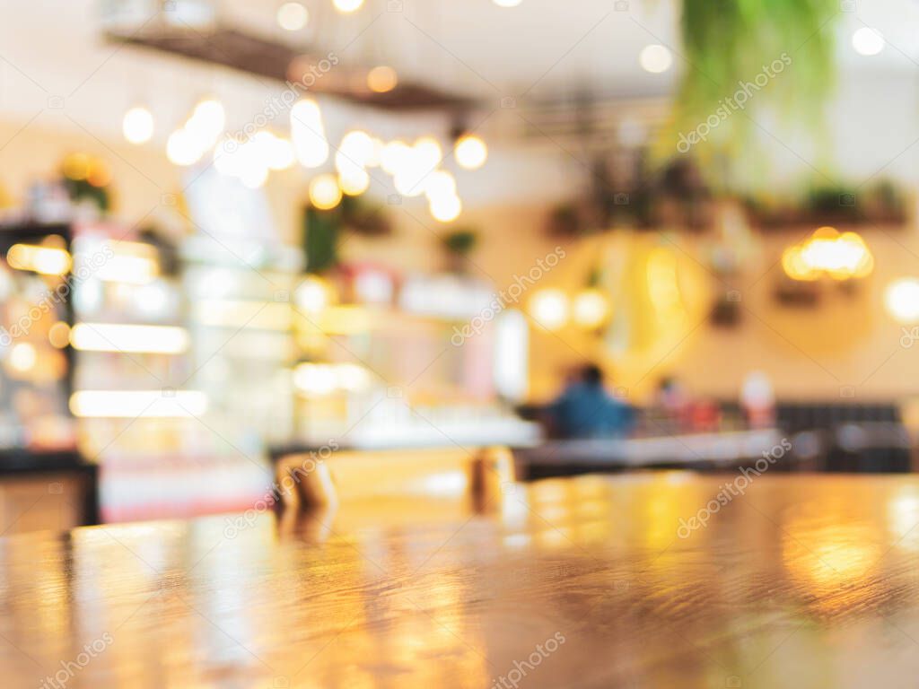 blurred background of empty cafe with bokeh light