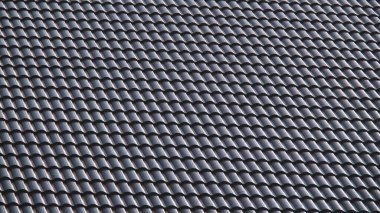 * * Geleneksel kiremitli çatının detaylı görüntüsü tekrarlayan bir desen ve dokulu yüzey sergiliyor, doğal ışıkta yakalanıyor.