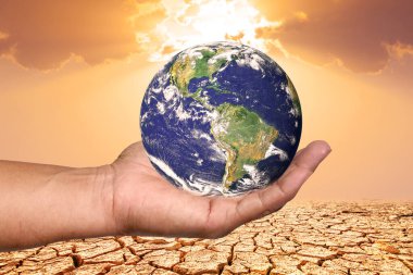 Küresel ısınma Dünya gezegeni bir elinde.