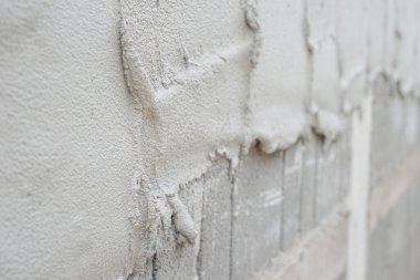 İnce karışık harç dokusu tuğla blokları duvarını sıva, seçici odak                                                                                                                               