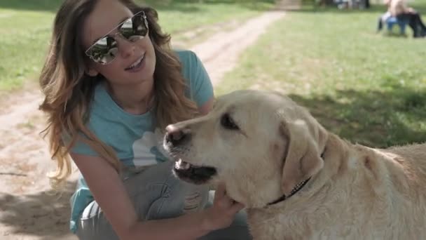 Girl playing with dog — Stock Video