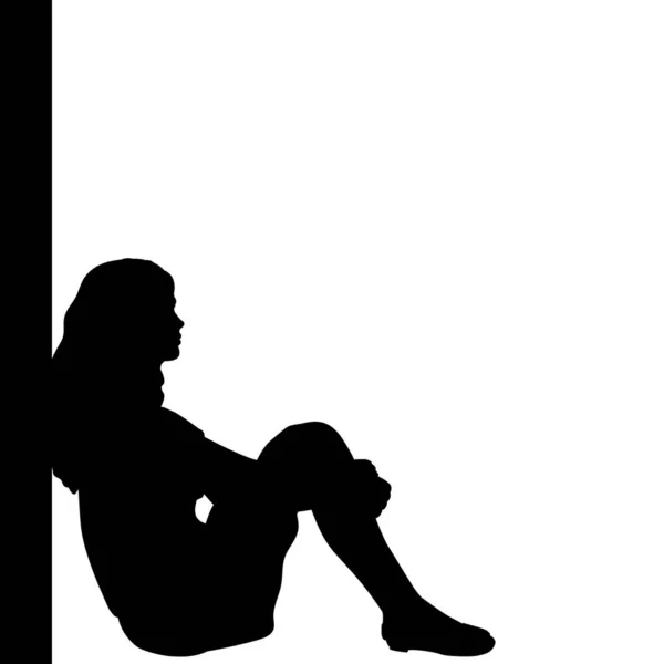 Силуэт задумчивой девушки, сидящей у стены — стоковый вектор
