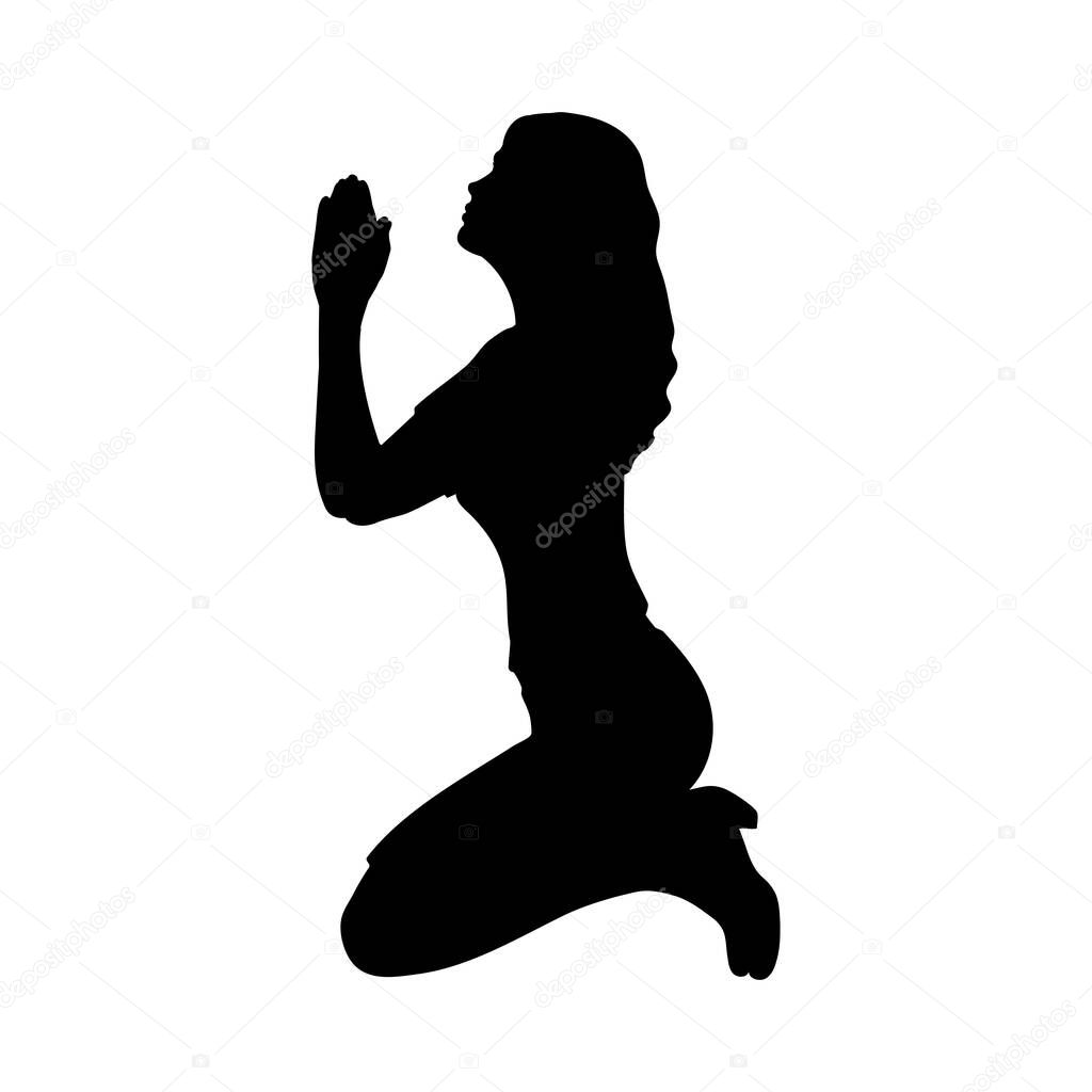 Silhouette of woman sitting on her knees praying asking for help