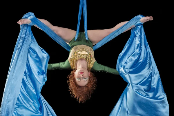 Young woman doing exercise on aerial silk — Stock Photo, Image