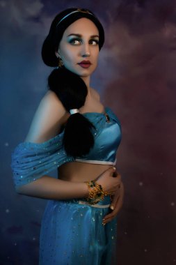 Beautiful princess closeup with magic lamp in her hands. Art photo.Jasmine princess cosplay.