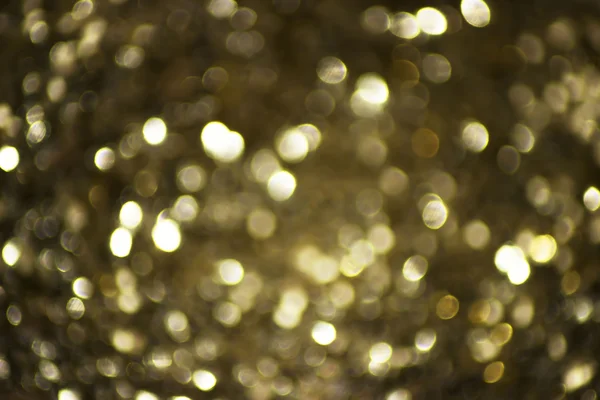 Luces borrosas con efecto bokeh fondo dorado. Concepción suave y borrosa —  Fotos de Stock