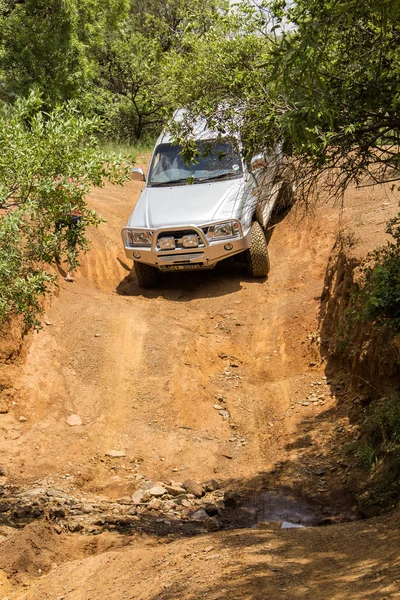 Four-wheel drive vehicle Toyota Hilux  is doing off-road trail. — Stock Photo, Image