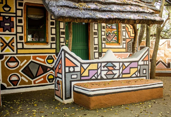 African rondavel - house  in traditional ethnic tribal Ndebele style looking like modern boho chic. — Stock Photo, Image