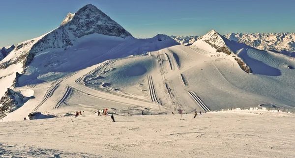 Mountain top casts a shadow.