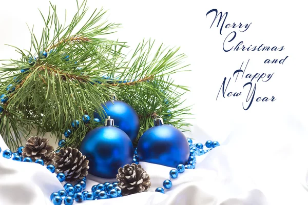 Blue Christmas balls with pine branches and pine cones on a whit — Stock Photo, Image