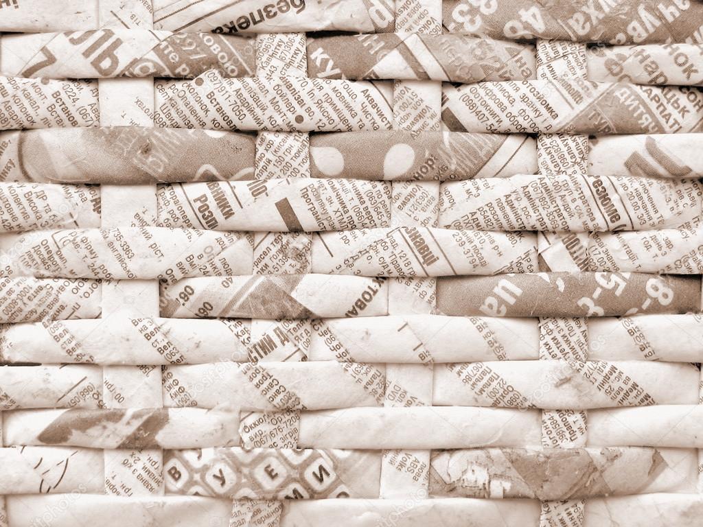 Twisted weaving newspapers. Abstract textured background.