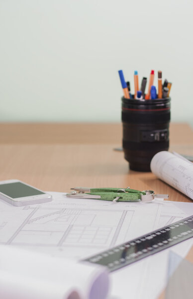 Architectural blueprints and blueprint rolls and a drawing instruments