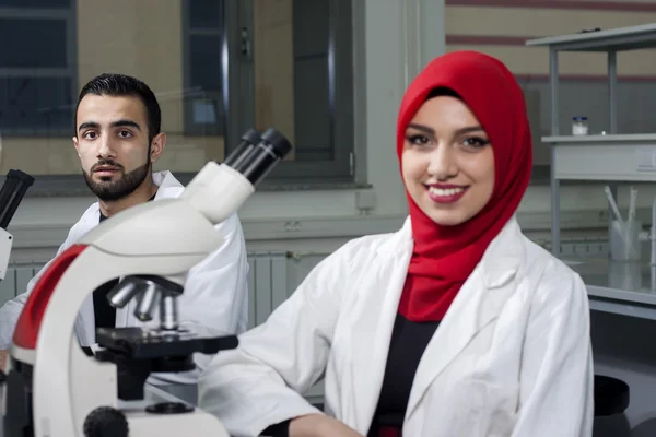 Group of young medical workers are working in lab as lab technician